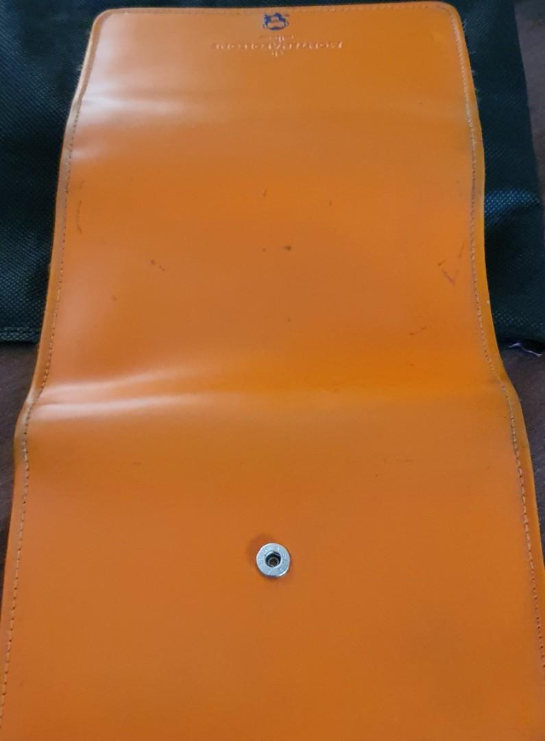 Original MONTENAPOLEONE Milano Wallet (Category: Wallets & Card holders) located in San Pedro. Submitted by czars (Listing ID 1004251740, Image 2). Description: An original Montenapoleone Milano wallet in tangerine color with several card slots . Magnetic snaps and zippers are working perfectly. This was originally bought in New Zealand. issue: with slight damage (see last photo) some penmarks (but might be removed with bleaching solutions) signs