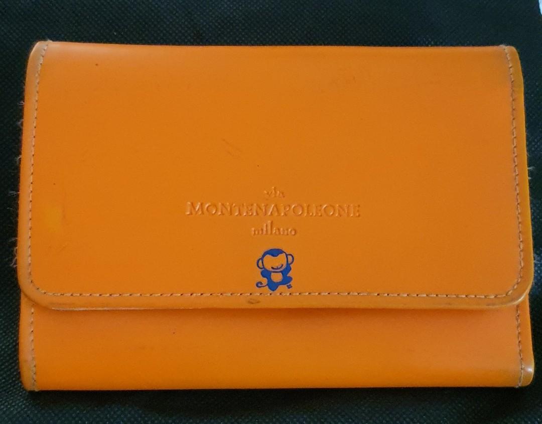 Original MONTENAPOLEONE Milano Wallet (Category: Wallets & Card holders) located in San Pedro. Submitted by czars (Listing ID 1004251740, Image 1). Description: An original Montenapoleone Milano wallet in tangerine color with several card slots . Magnetic snaps and zippers are working perfectly. This was originally bought in New Zealand. issue: with slight damage (see last photo) some penmarks (but might be removed with bleaching solutions) signs