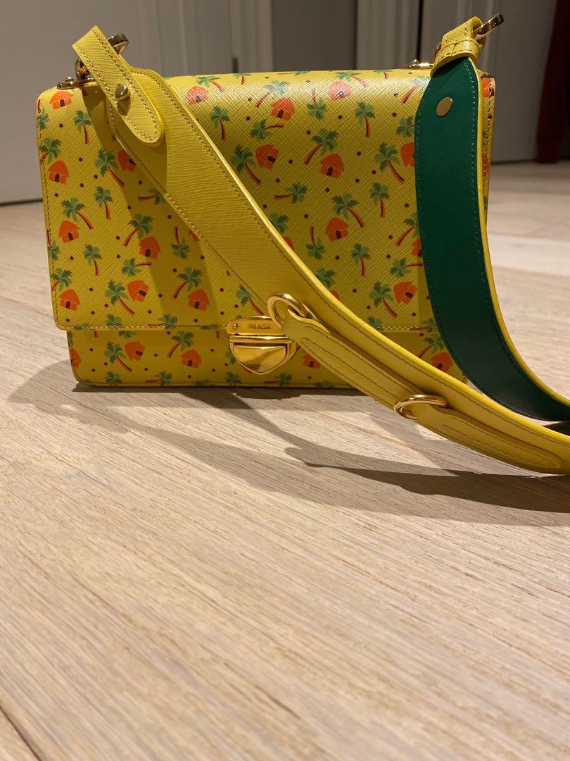 Authentic Prada tiki hut cross body leather bag (Category: Bags & Wallets) located in Toronto. Submitted by babygirlneeks (Listing ID 1004974889, Image 2). Description: Limited collectors edition Prada bag. Original price was $3500 before taxes. Comes with dust bag and box. .