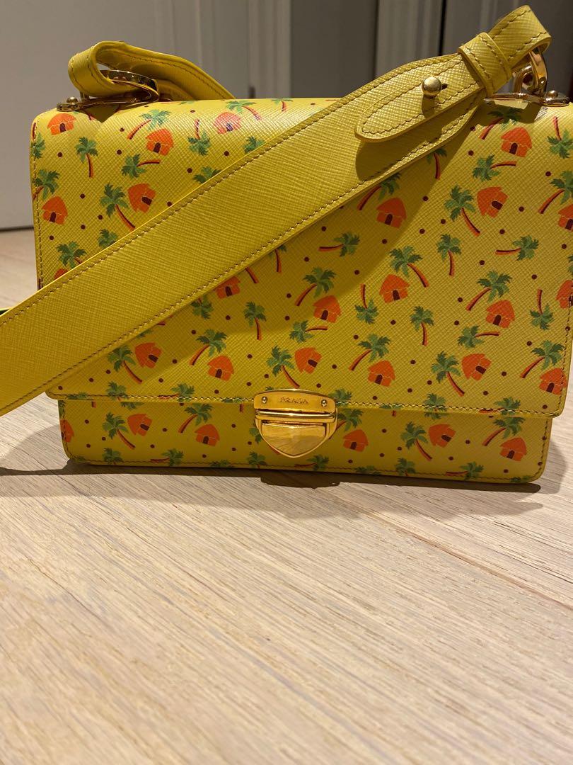 Authentic Prada tiki hut cross body leather bag (Category: Bags & Wallets) located in Toronto. Submitted by babygirlneeks (Listing ID 1004974889, Image 3). Description: Limited collectors edition Prada bag. Original price was $3500 before taxes. Comes with dust bag and box. .