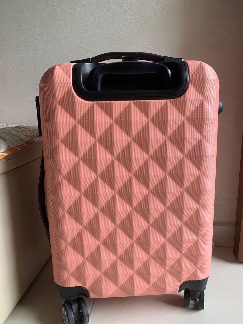 pastel pink luggage