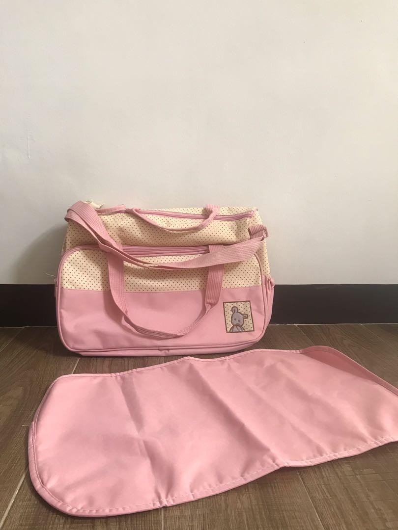 Diaper Bag Pink (Category: Diaper Bags & Wetbags) located in Quezon City. Submitted by konmarimama (Listing ID 1013175758, Image 3). Description: Brand new, kep unused pink diaper bag. Comes with free diaper changing pad. .