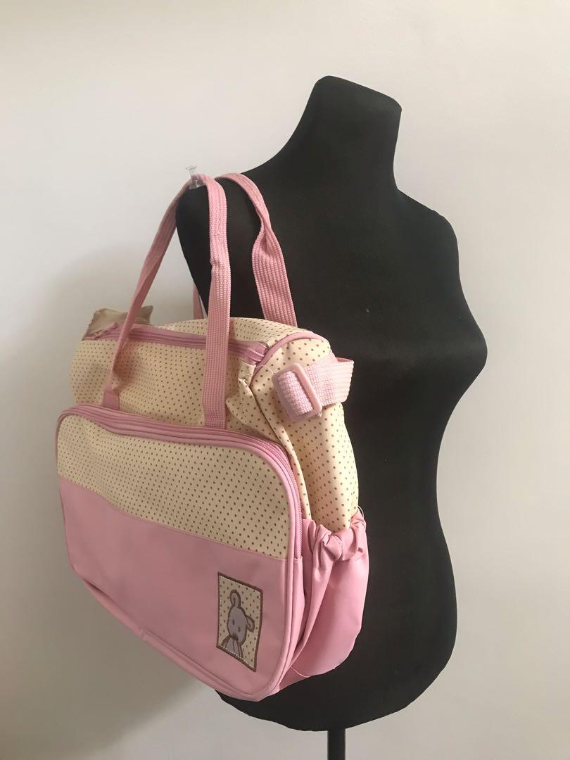 Diaper Bag Pink (Category: Diaper Bags & Wetbags) located in Quezon City. Submitted by konmarimama (Listing ID 1013175758, Image 1). Description: Brand new, kep unused pink diaper bag. Comes with free diaper changing pad. .