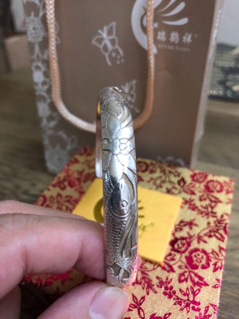 Silver Bangle (Category: Jewelry) located in Singapore. Submitted by mimosa1972 (Listing ID 1014205990, Image 3). Description: Used Pure Silver bangle . ( Double Fish) Engraving for sale. Bought from Yunnan China Thanks for viewing .