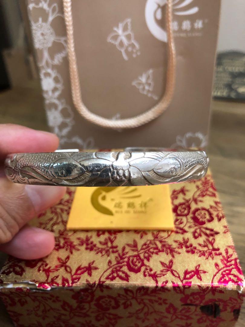 Silver Bangle (Category: Jewelry) located in Singapore. Submitted by mimosa1972 (Listing ID 1014205990, Image 1). Description: Used Pure Silver bangle . ( Double Fish) Engraving for sale. Bought from Yunnan China Thanks for viewing .