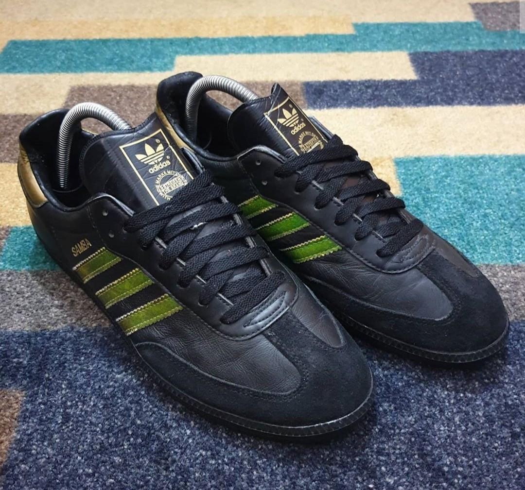 Black adidas with gold new arrivals stripes