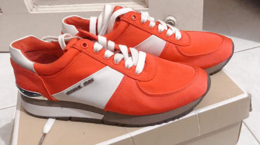 orange designer sneakers