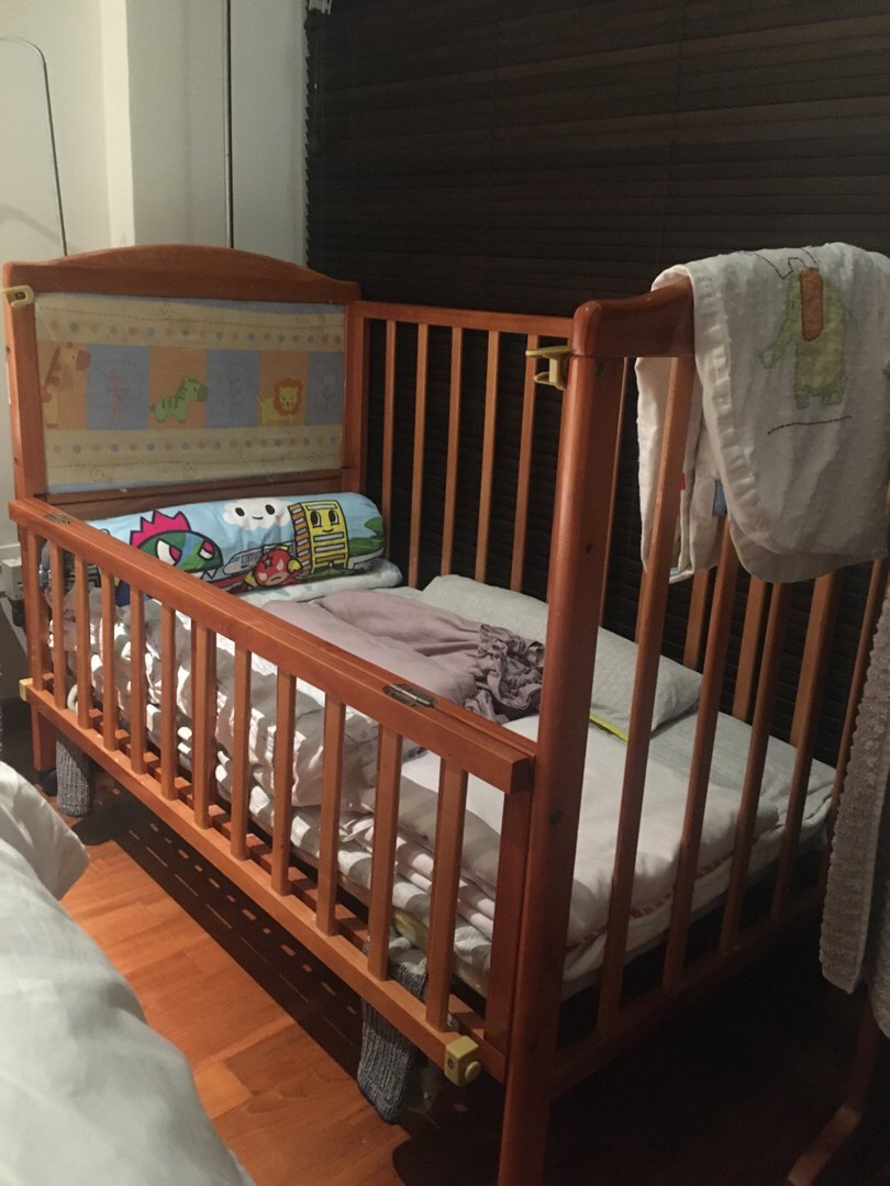 Crib with new arrivals fold down side