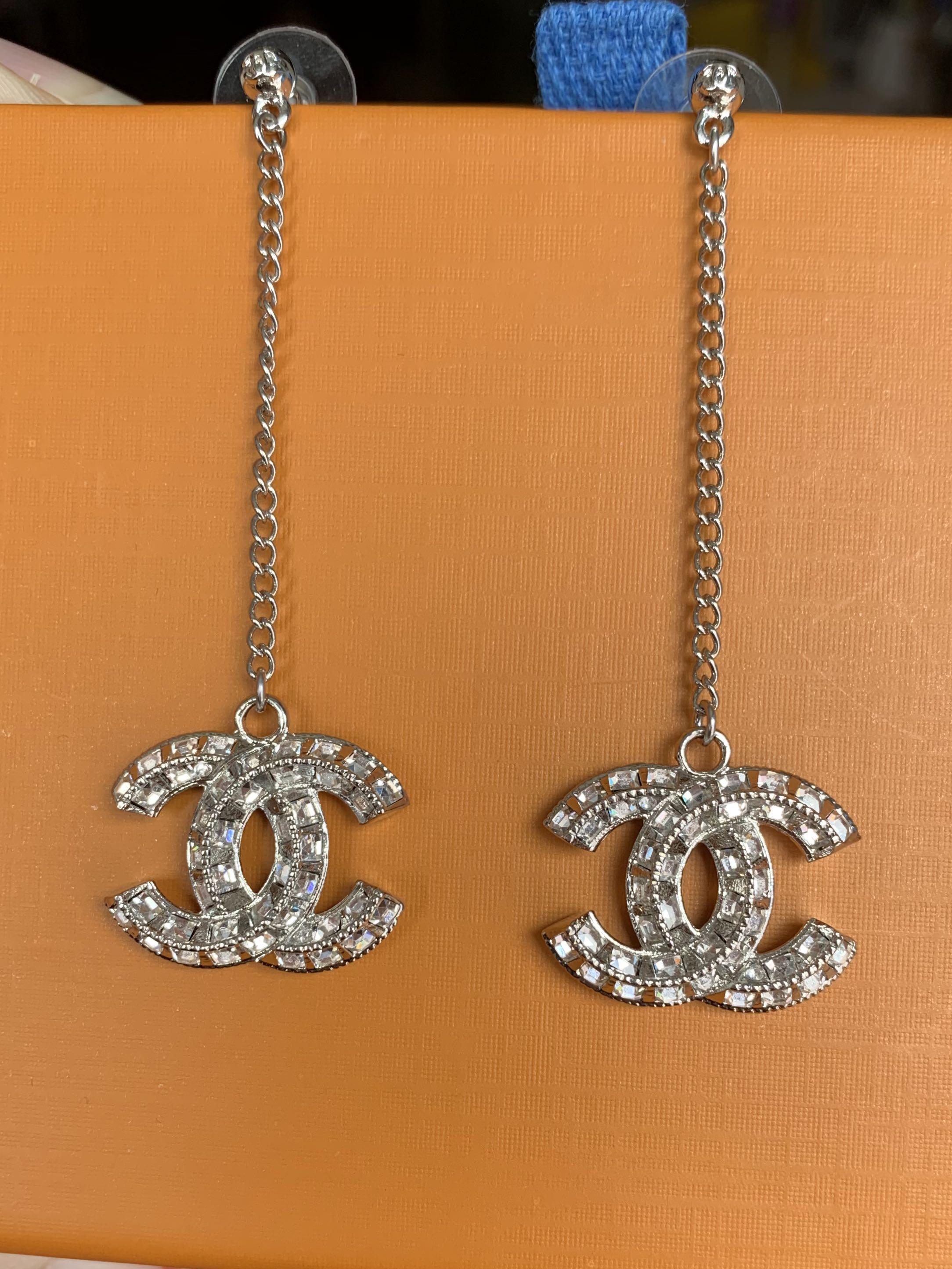Cc discount dangle earrings