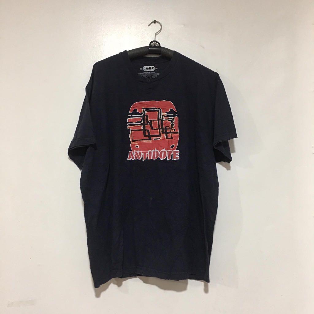 Antidote Graphic Shirt (Category: Tshirts & Polo Shirts ) located in Quezon City. Submitted by emporium.vtg (Listing ID 1010674277, Image 1). Description: Antidote Shirt . Size XL Length: 29.5” Width: 26” Issue: holes on the bottom.