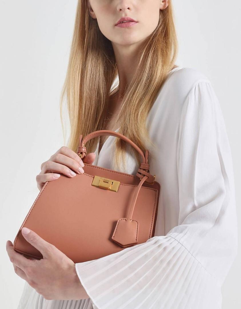 Classic metal detail push outlet lock bag
