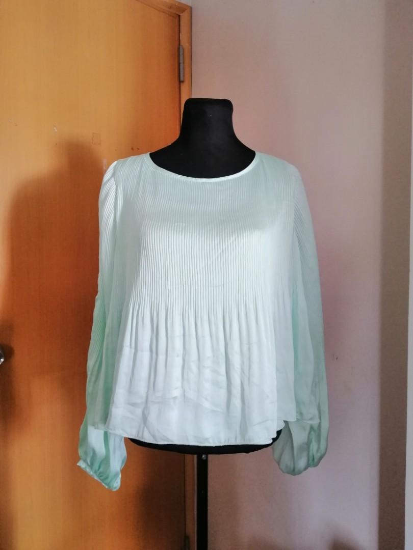 Couture Blouse or Top (Category: Blouses) located in Taguig. Submitted by fruity_mint (Listing ID 1010577529, Image 1). Description: VGC Mint Green..