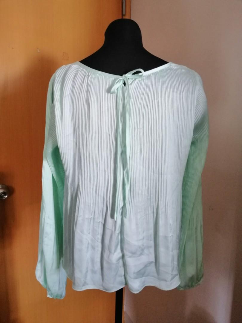 Couture Blouse or Top (Category: Blouses) located in Taguig. Submitted by fruity_mint (Listing ID 1010577529, Image 2). Description: VGC Mint Green..