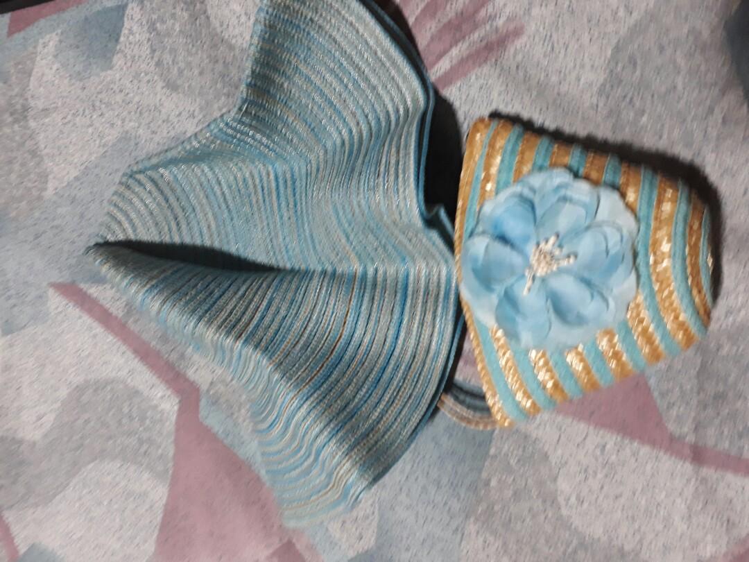 Hat in a purse (Category: Hats & Beanies) located in Quezon City. Submitted by declutteringusedbrandedstuff (Listing ID 1014981506, Image 3). Description: Slightly used cute special head dress. Payment thru BDO online transfer..