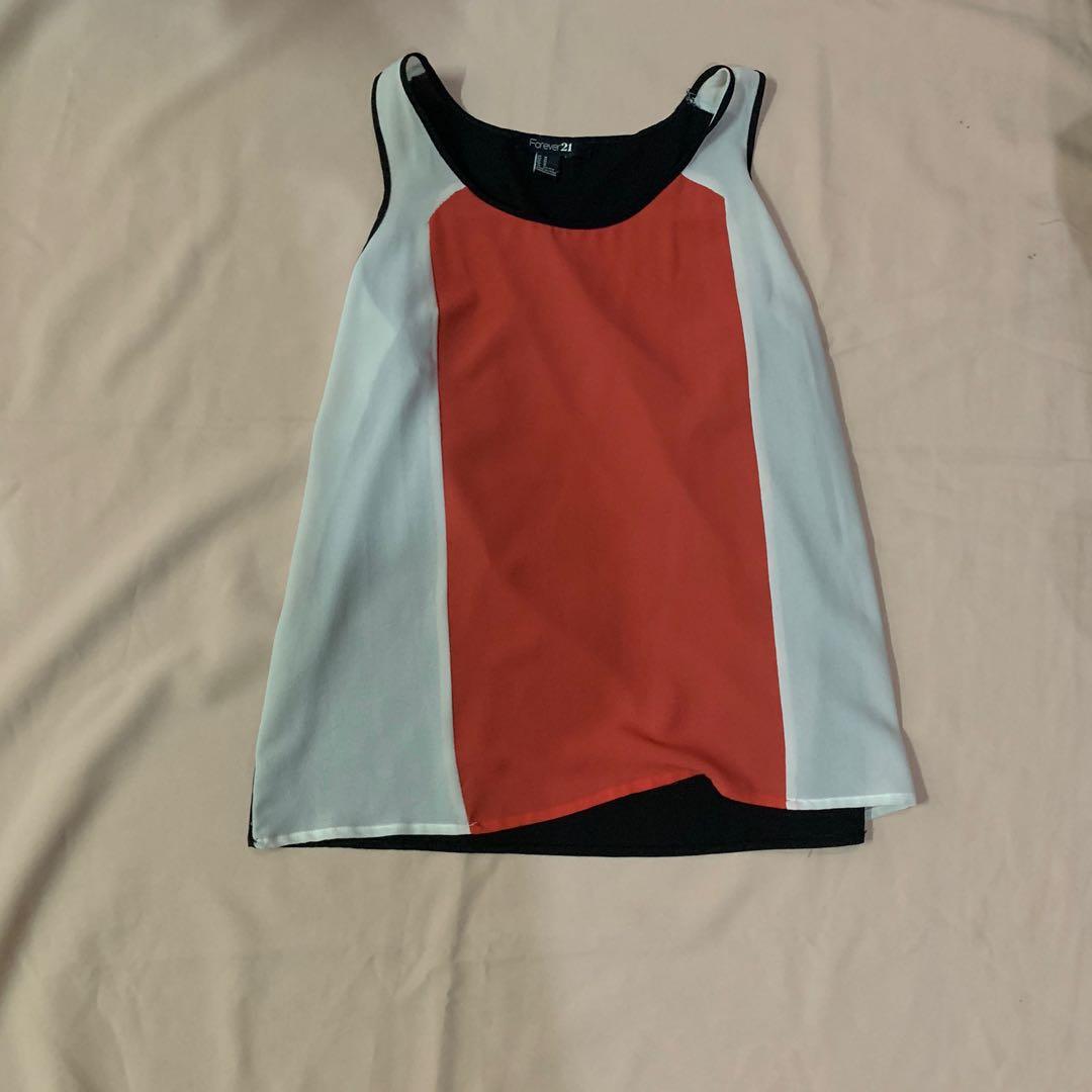 Forever 21 sheer top (Category: Sleeveless) located in Marikina City. Submitted by abd003 (Listing ID 1015080036, Image 1). Description: Sheer top good condition.