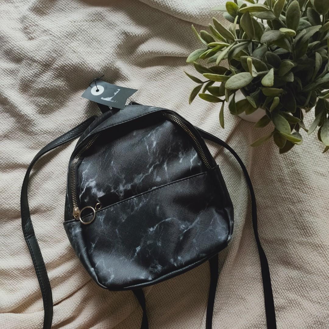 typo marble backpack