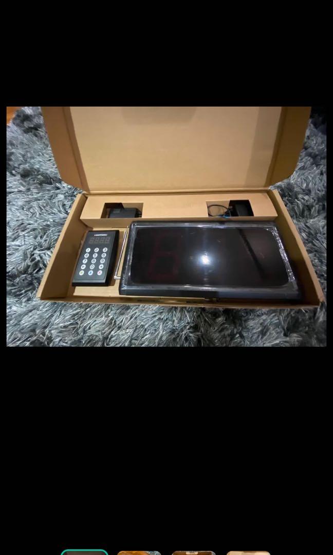 Wireless calling system (Category: Entertainment Systems & Smart Home Devices) located in Singapore. Submitted by ihatefishcake (Listing ID 1015174154, Image 3). Description: Comes with number panel and number pad to type queue number Both separate pieces able to wirelessly connect instantly Queue number for bubble tea store or hawkers Very good condition, almost as good as new All new supply sold out 1 left.