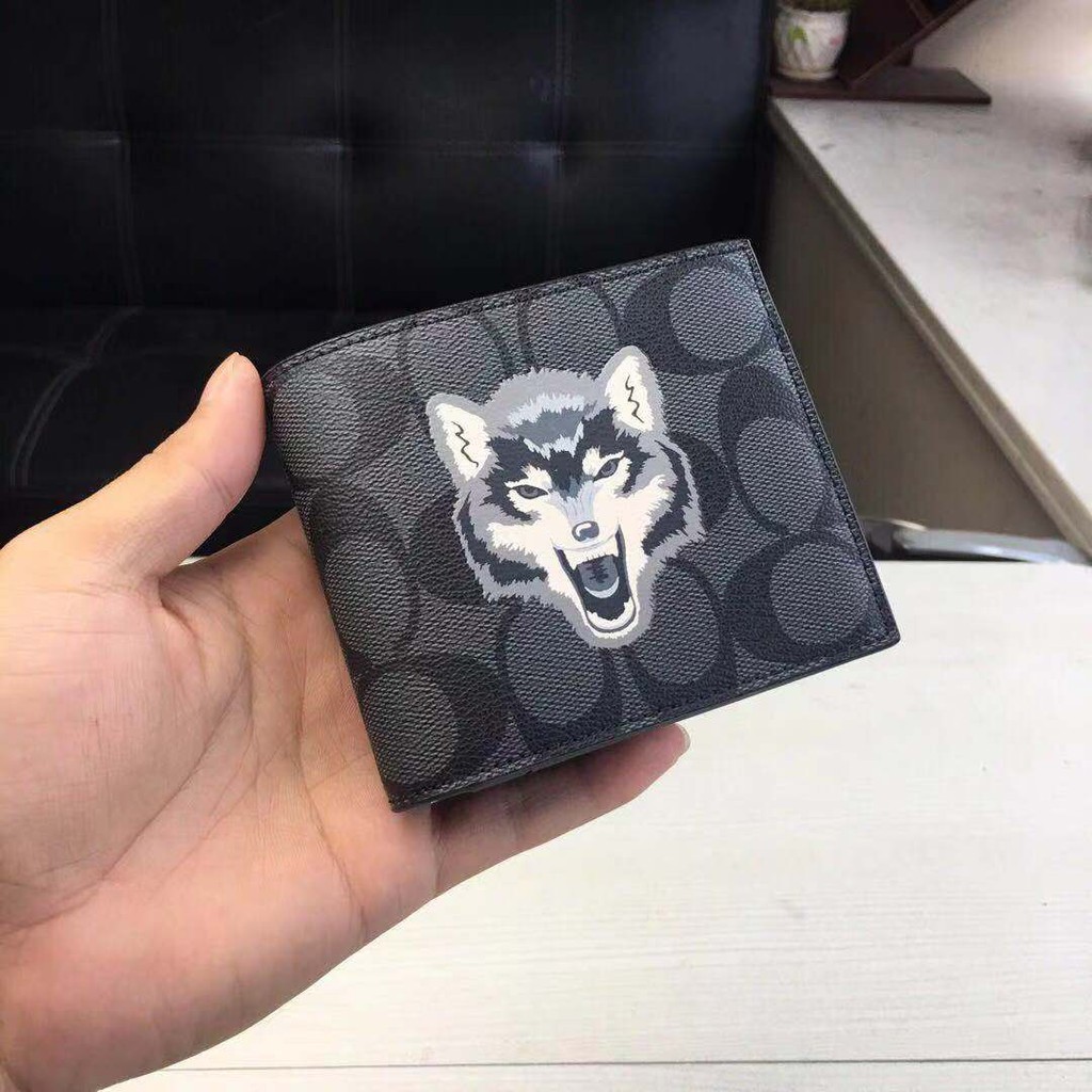 Coach wolf wallet fake vs real store