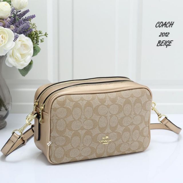 Coach double zip sling bag hotsell