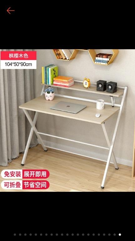 2 layer foldable table (Category: Tables & Sets) located in Singapore. Submitted by carolmk (Listing ID 1016081069, Image 3). Description: bot wrong size, too big for my room, received in June. very new, sturdy n heavy table. condition: used till now, 9 of 10 color: wood color with white leg size: LxWxHcm 100 x 50 x 74 / top of second layer 93cm from floor (see last photo) on line price is $55-$65 (cheaper ones are smaller, without 2 layer or wit