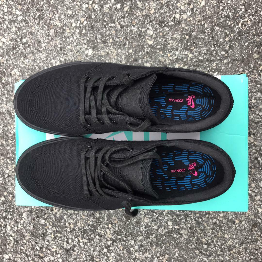 Nike janoski triple black sale
