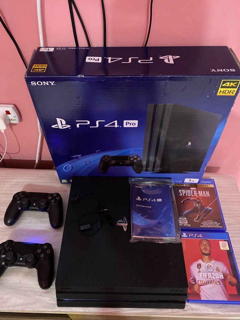 Playstation 4 with fifa 20 and two store controllers