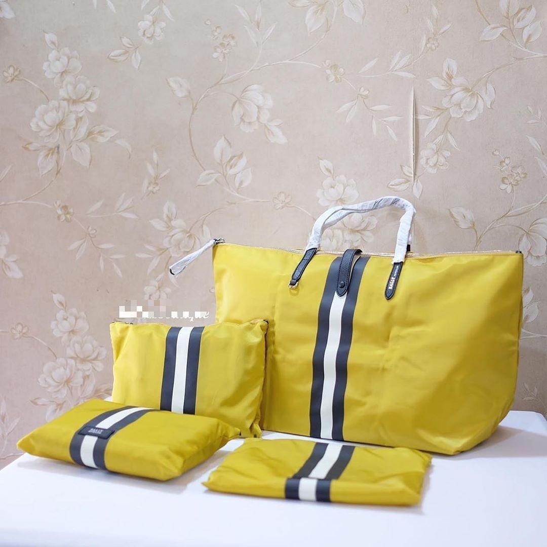 Bally Travel Bag Foldable Giallo Canary yellow bs dilipat dimasukkan pouch sz 42x32 cm Barang Mewah Tas Dompet di Carousell