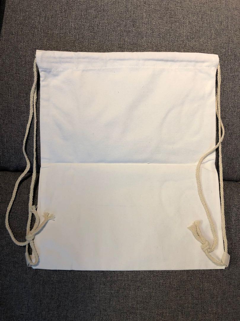 Drawstring Bag (Category: Tote Bags) located in Singapore. Submitted by mummymcqueen (Listing ID 1016512748, Image 1). Description: Dimension - 34 cm x 40cm Self collect at Trivex Available qty: 40.