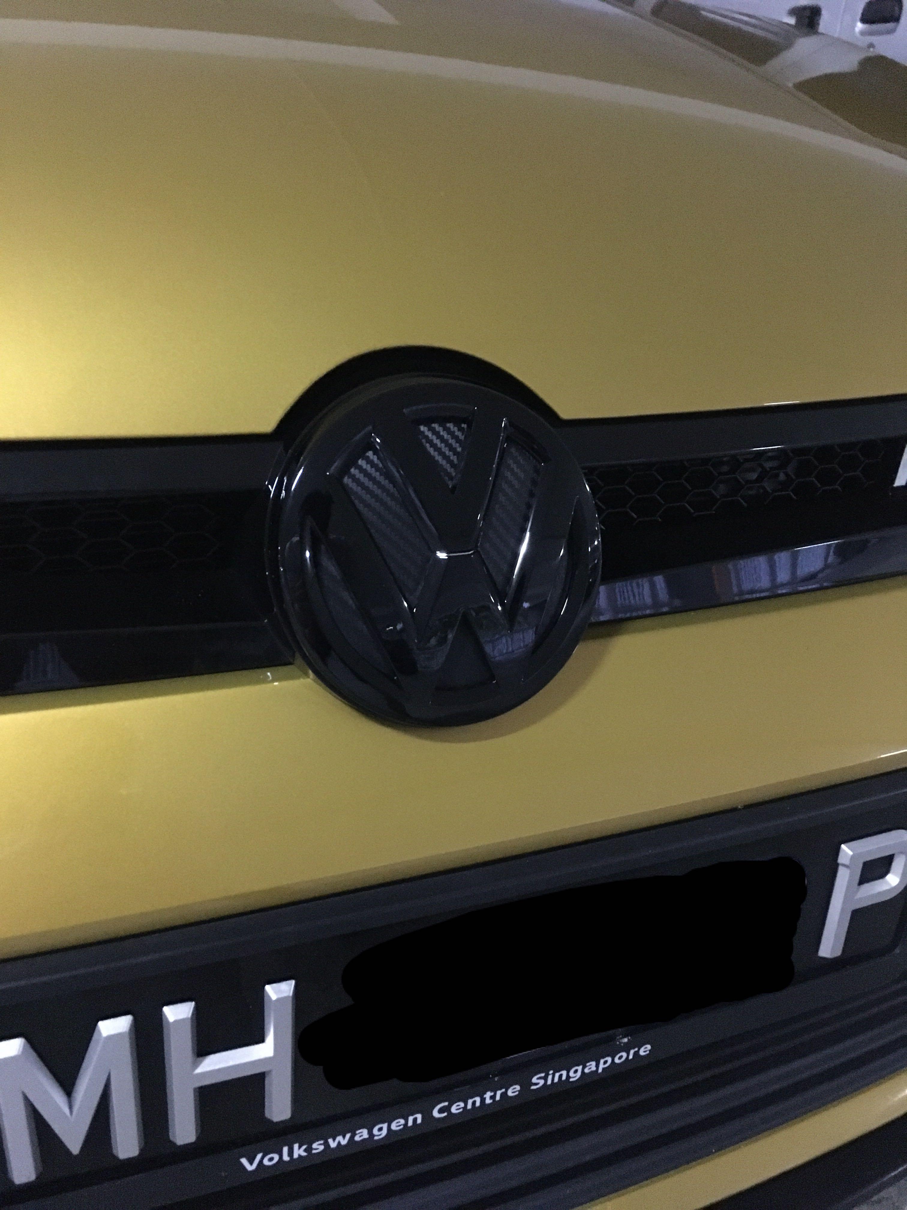 vw passat front emblem replacement