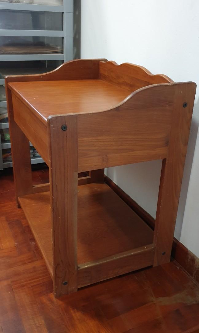 Side Table (Category: Tables & Sets) located in Singapore. Submitted by kozie (Listing ID 1016556689, Image 3). Description: Picture 1: Solid wood side table. Seldom used thus selling. Comes with a pull out drawer. Condition is good. Not for fussy buyer. Measurement: Length 21 inches Breadth: 15.5 inches Height: 22.5 inches Pls arrange yr own transport. Cash & carry..