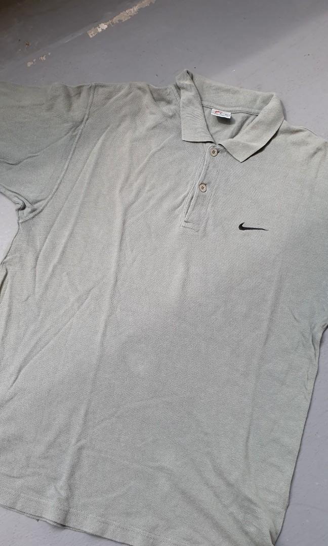 white and olive green nike shirt