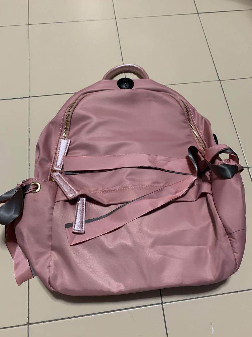 Nylon Backpack (Category: Backpacks) located in Singapore. Submitted by coffee4life (Listing ID 1016834631, Image 3). Description: 1 for $35 Available in Black & Pink.