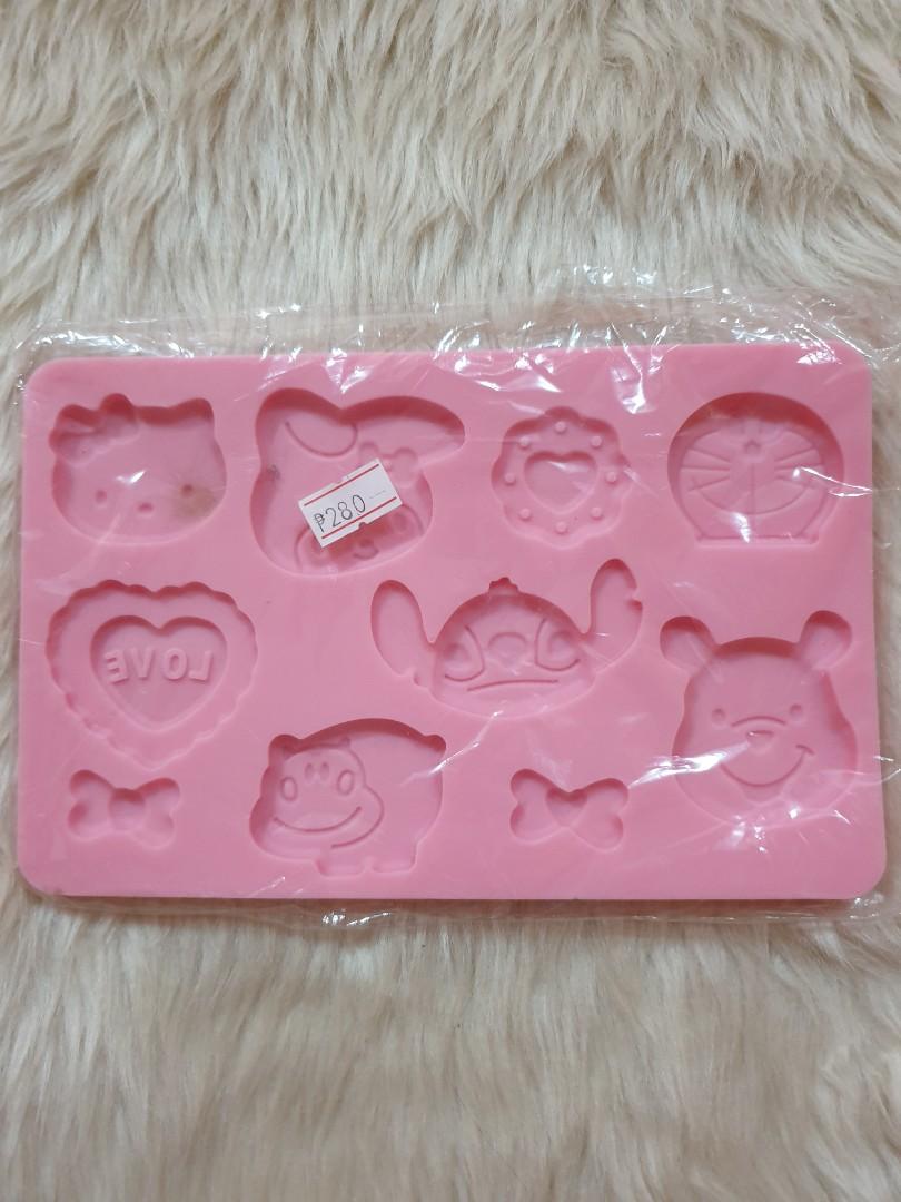 Sillicone Moulds (Category: Bakeware) located in Taguig. Submitted by misskweezy (Listing ID 1016764990, Image 1). Description: PRICE IS FIXED. Lugi na sa shipping. Bento or baking hobby did not push thru. Stored lang. 1. Hello Kitty, My Melody, Lilo & Stitch, Doraemon, Winnie the Pooh (New) - Php 280 2. Hello Kitty Round Small (New/Loose) - Php 120 3. Transformers (New/Loose) - Php 150 4. Random Shapes/Animals (New) - Php 80 Condition: New/Used 