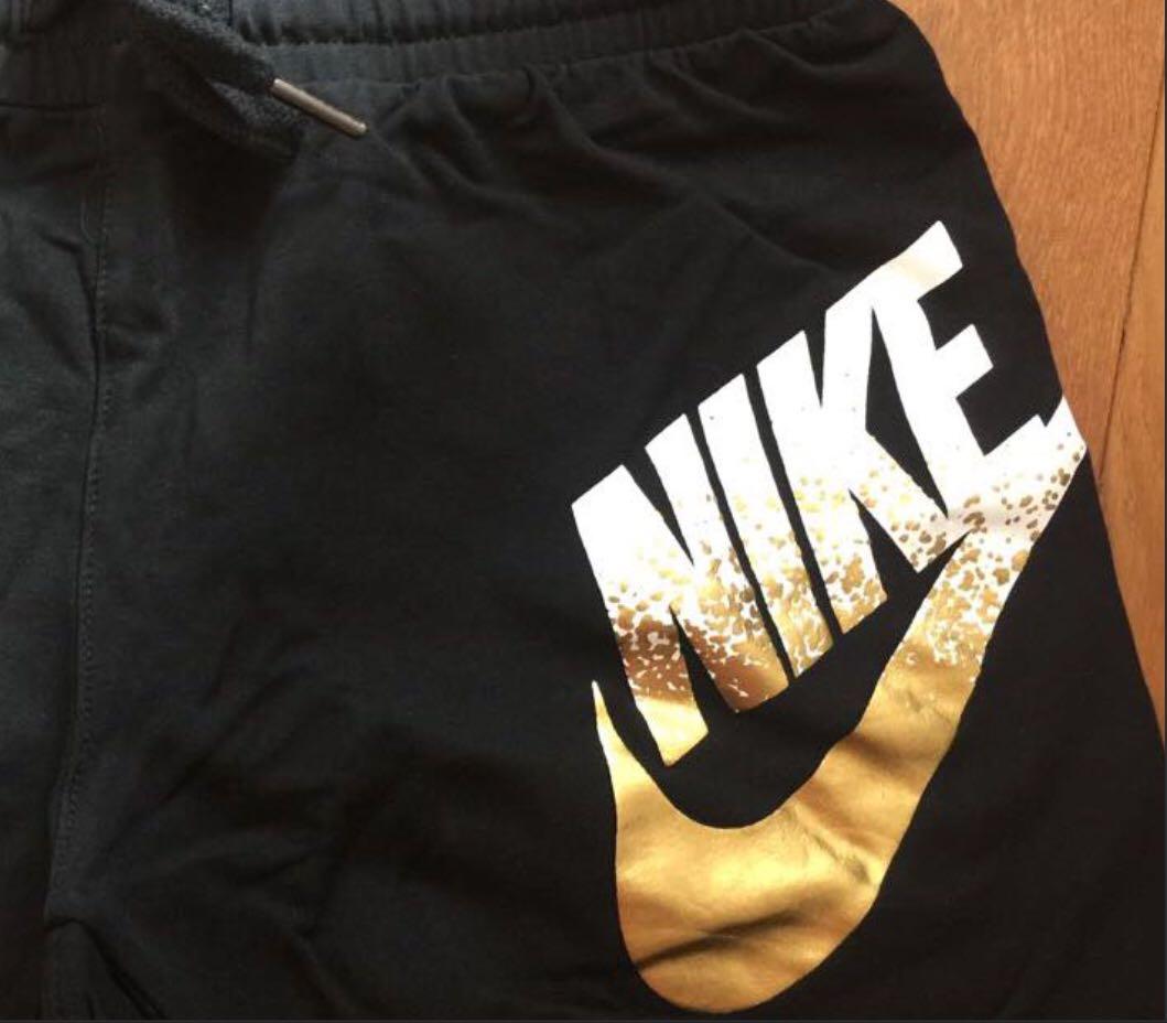nike black gold shorts