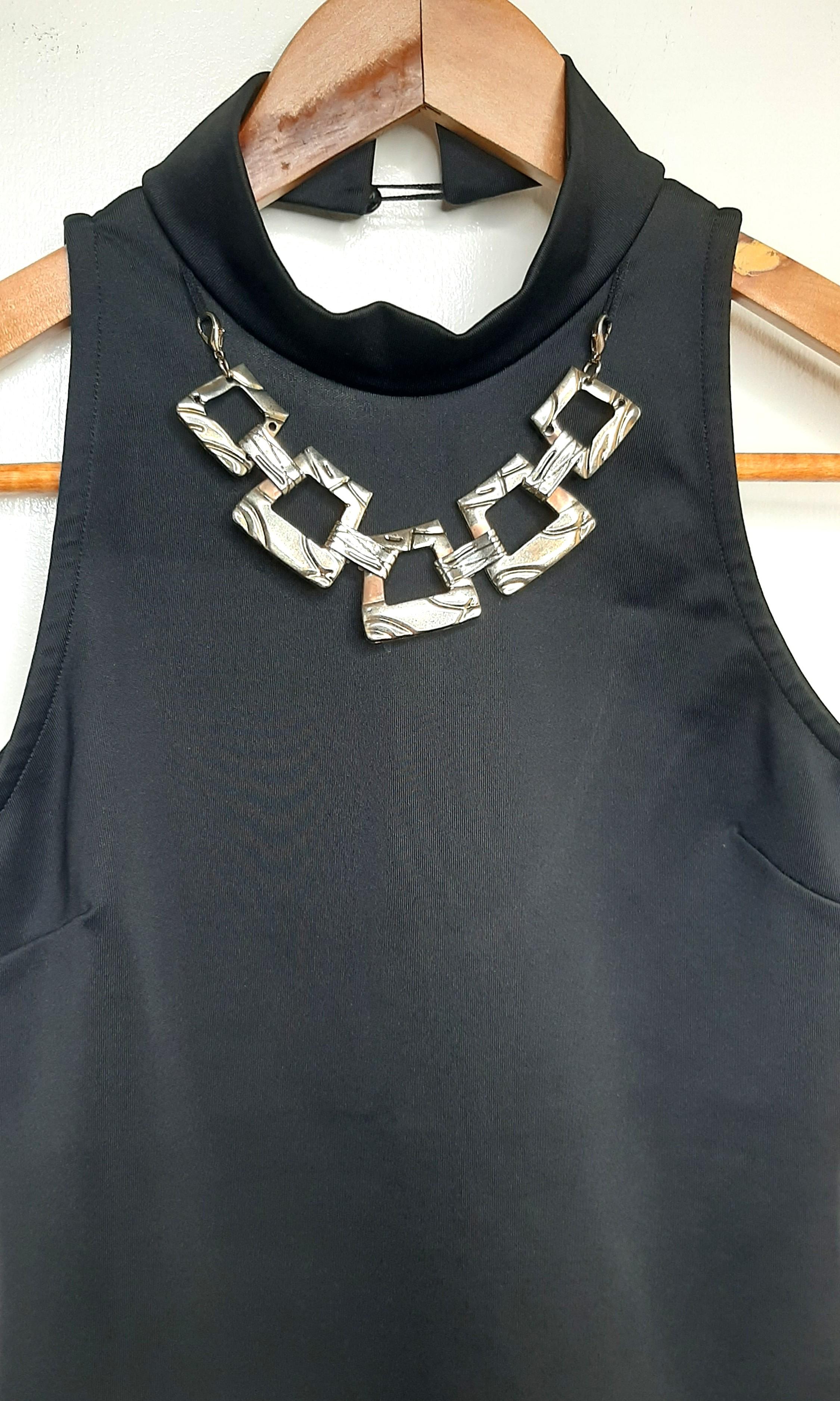 Rhode Island Bodysuit with built in necklace accessory (Category: Jumpsuits) located in Los Banos. Submitted by yannymae (Listing ID 1017122634, Image 2). Description: Sleeveless bodysuit with snap button at the crotch area. Nice fabric..