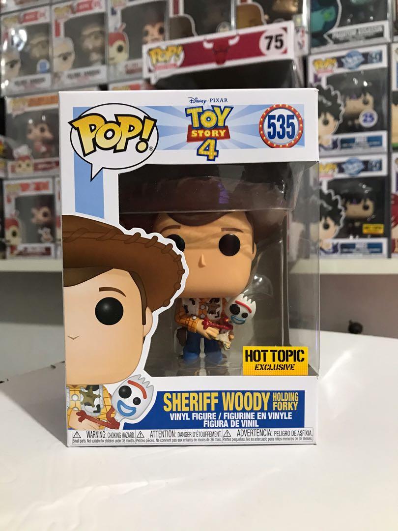 sheriff woody holding forky funko pop