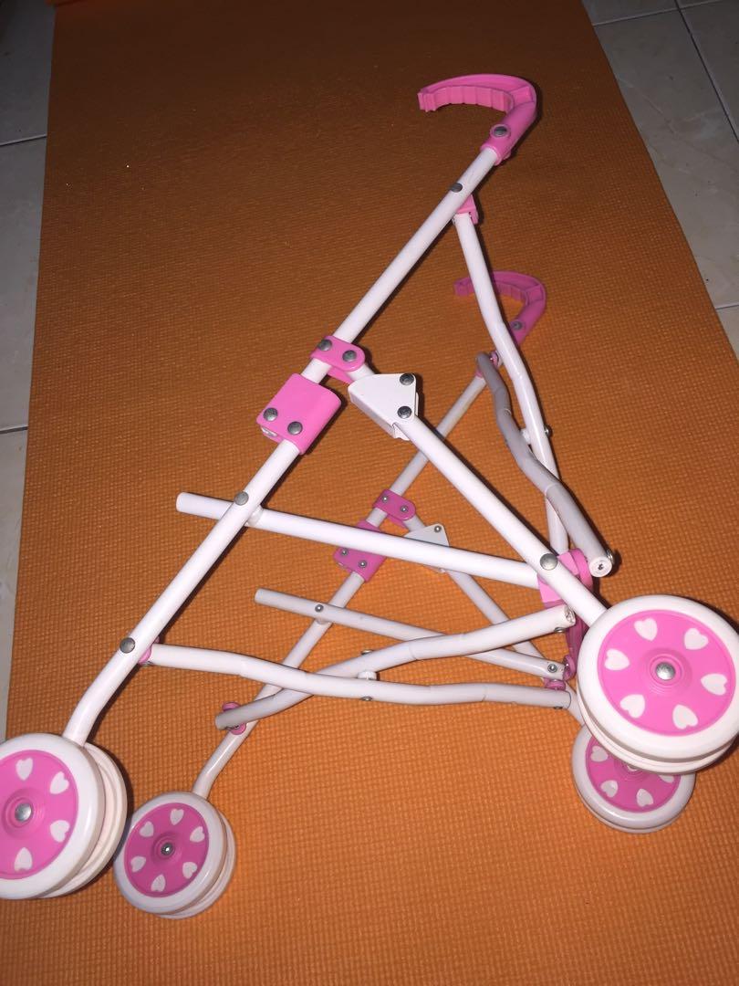 Pink Doll Stroller (Category: Strollers) located in Makati City. Submitted by jennyitems (Listing ID 1017366829, Image 2). Description: Pink DOLL STROLLER Color: Pink & White Very nice! As seen in photos, natitiklop or can be Fold. Matibay! High Quality! Aside from this, I have other Doll Stroller, and Baby Alive & Stuffed Toys, just view my listings. Others are: GRACO Color Blue Big, GRACO Color Blue Small & Black Pink MACLAREN Big..