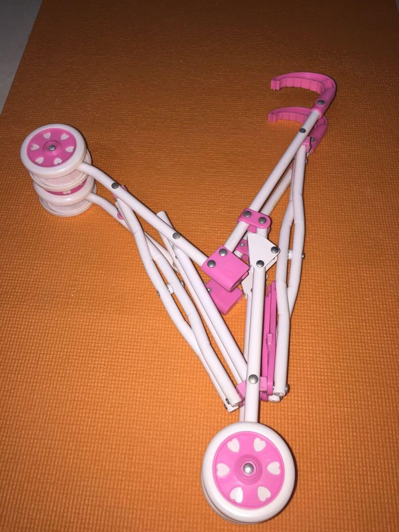 Pink Doll Stroller (Category: Strollers) located in Makati City. Submitted by jennyitems (Listing ID 1017366829, Image 3). Description: Pink DOLL STROLLER Color: Pink & White Very nice! As seen in photos, natitiklop or can be Fold. Matibay! High Quality! Aside from this, I have other Doll Stroller, and Baby Alive & Stuffed Toys, just view my listings. Others are: GRACO Color Blue Big, GRACO Color Blue Small & Black Pink MACLAREN Big..
