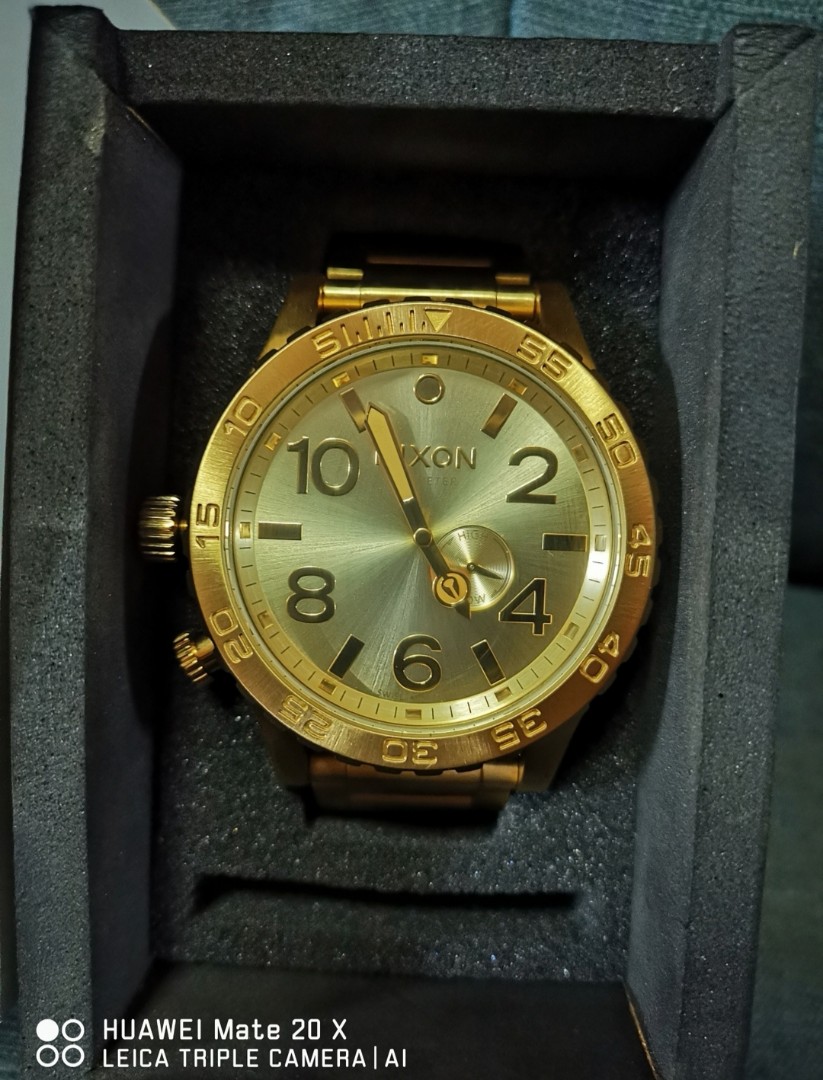 All gold nixon online