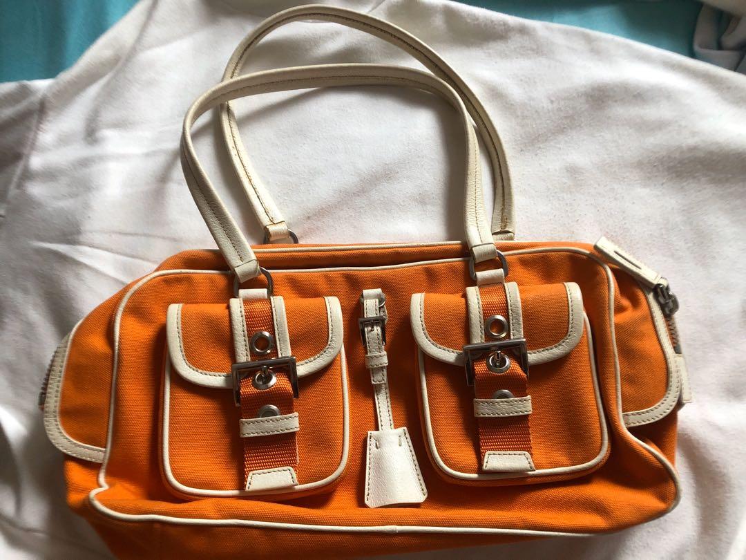 prada orange clutch