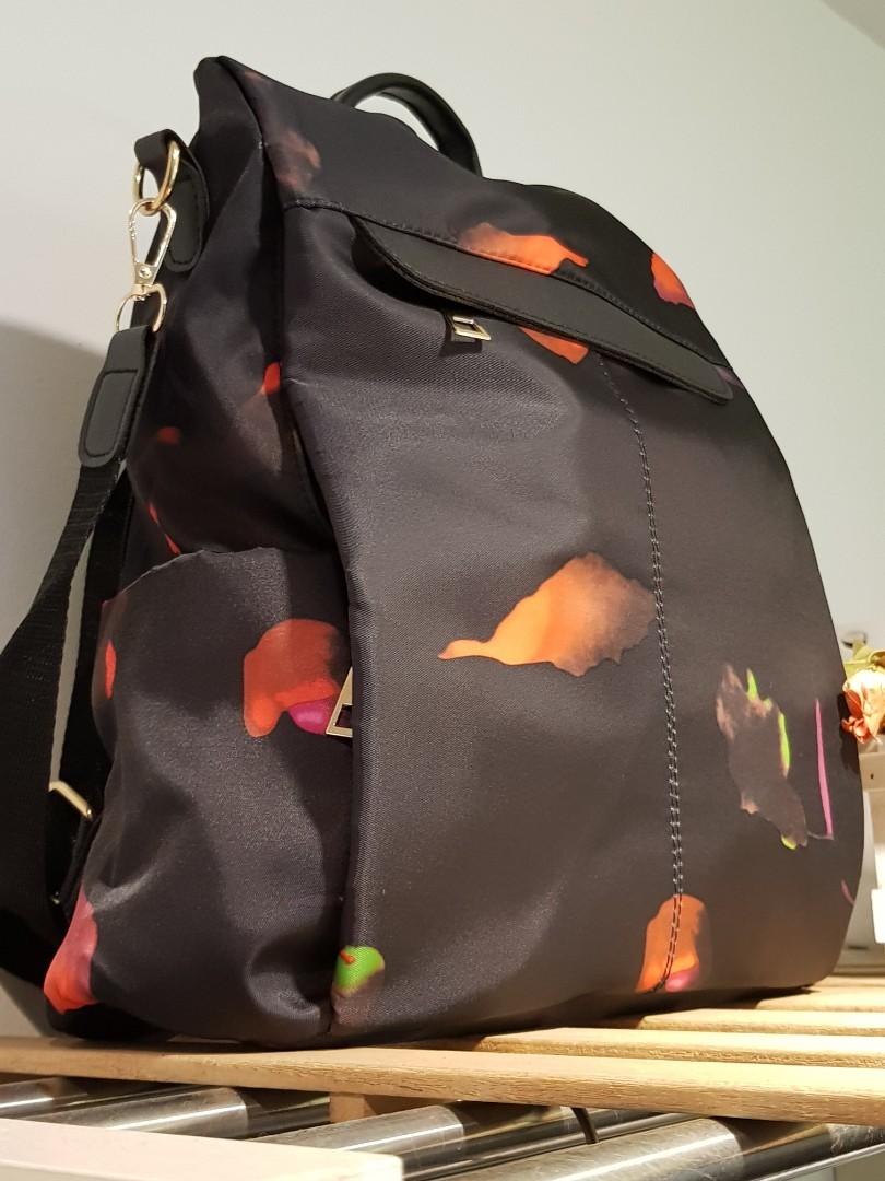 Zip around back detail on sale backpack