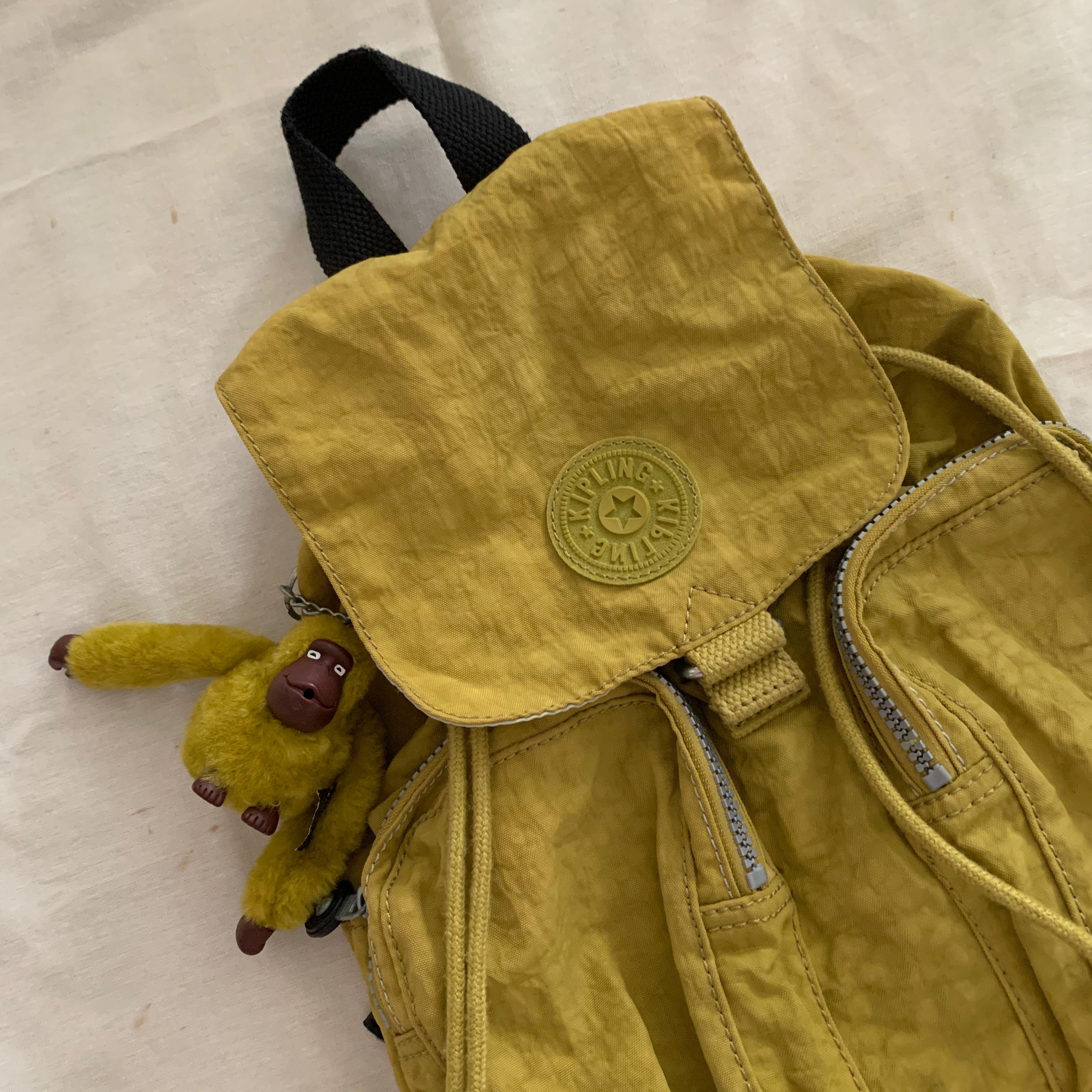 Kipling Green Drawstring Backpack (Category: Backpacks) located in Singapore. Submitted by bubblewrapped (Listing ID 1011474235, Image 2). Description: Authentic small Kipling backpack - 28cm width - 38cm height Waterproof material Condition: 10/10 .