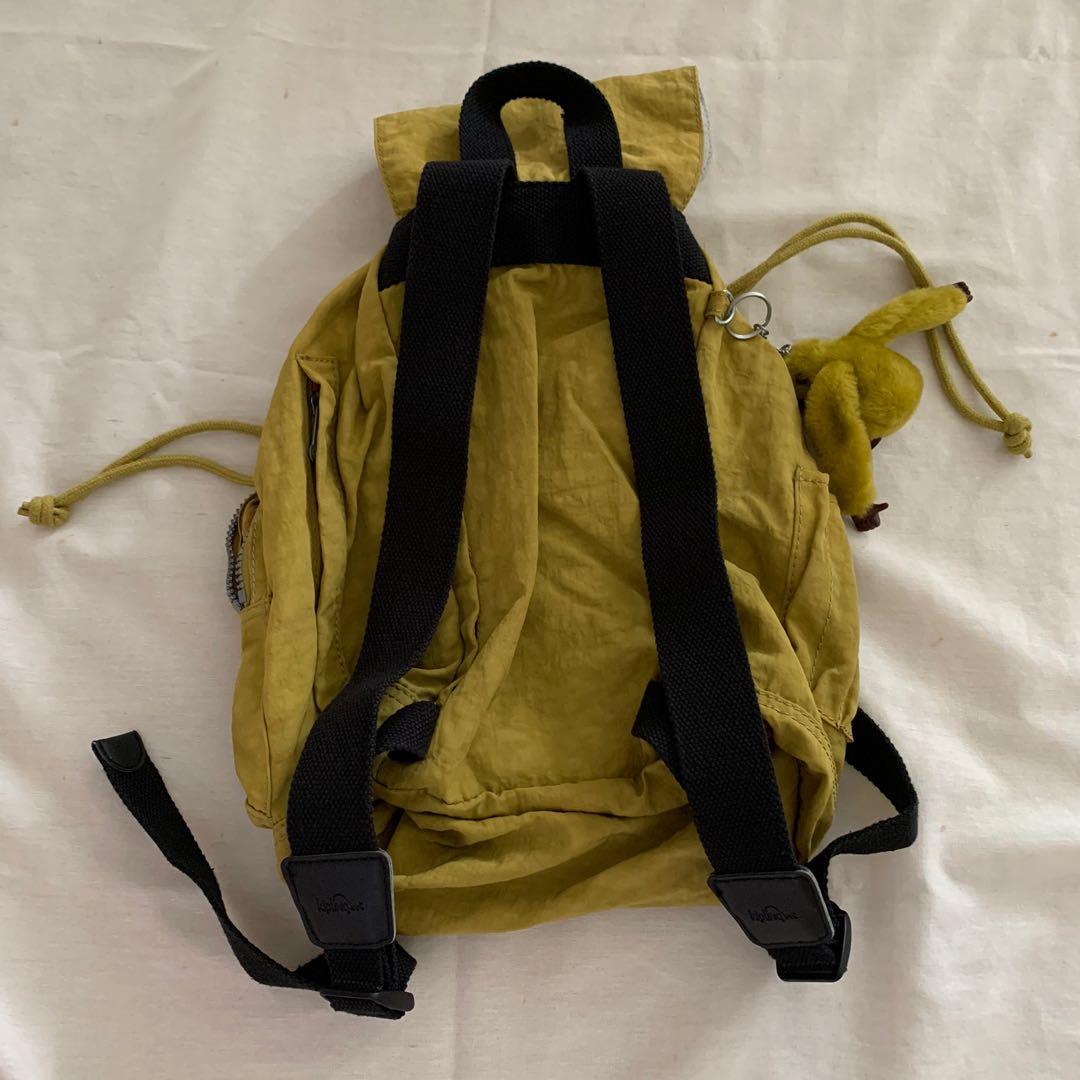 Kipling Green Drawstring Backpack (Category: Backpacks) located in Singapore. Submitted by bubblewrapped (Listing ID 1011474235, Image 4). Description: Authentic small Kipling backpack - 28cm width - 38cm height Waterproof material Condition: 10/10 .
