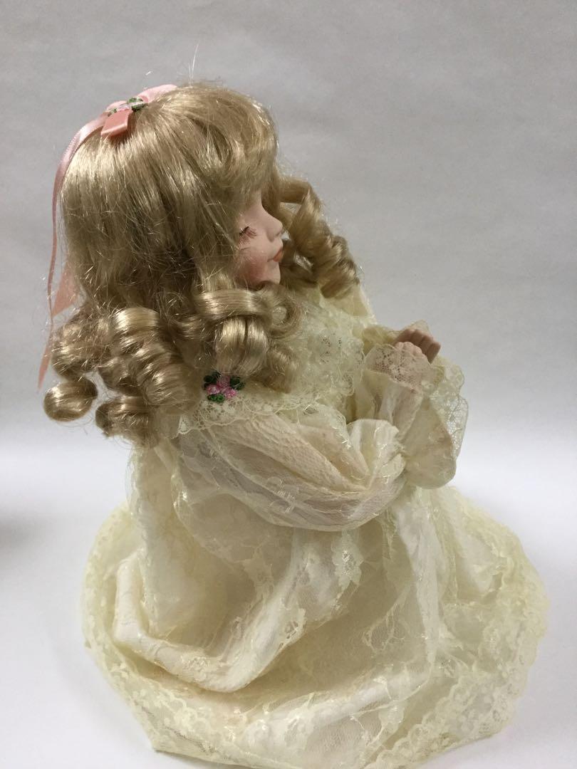 praying porcelain doll