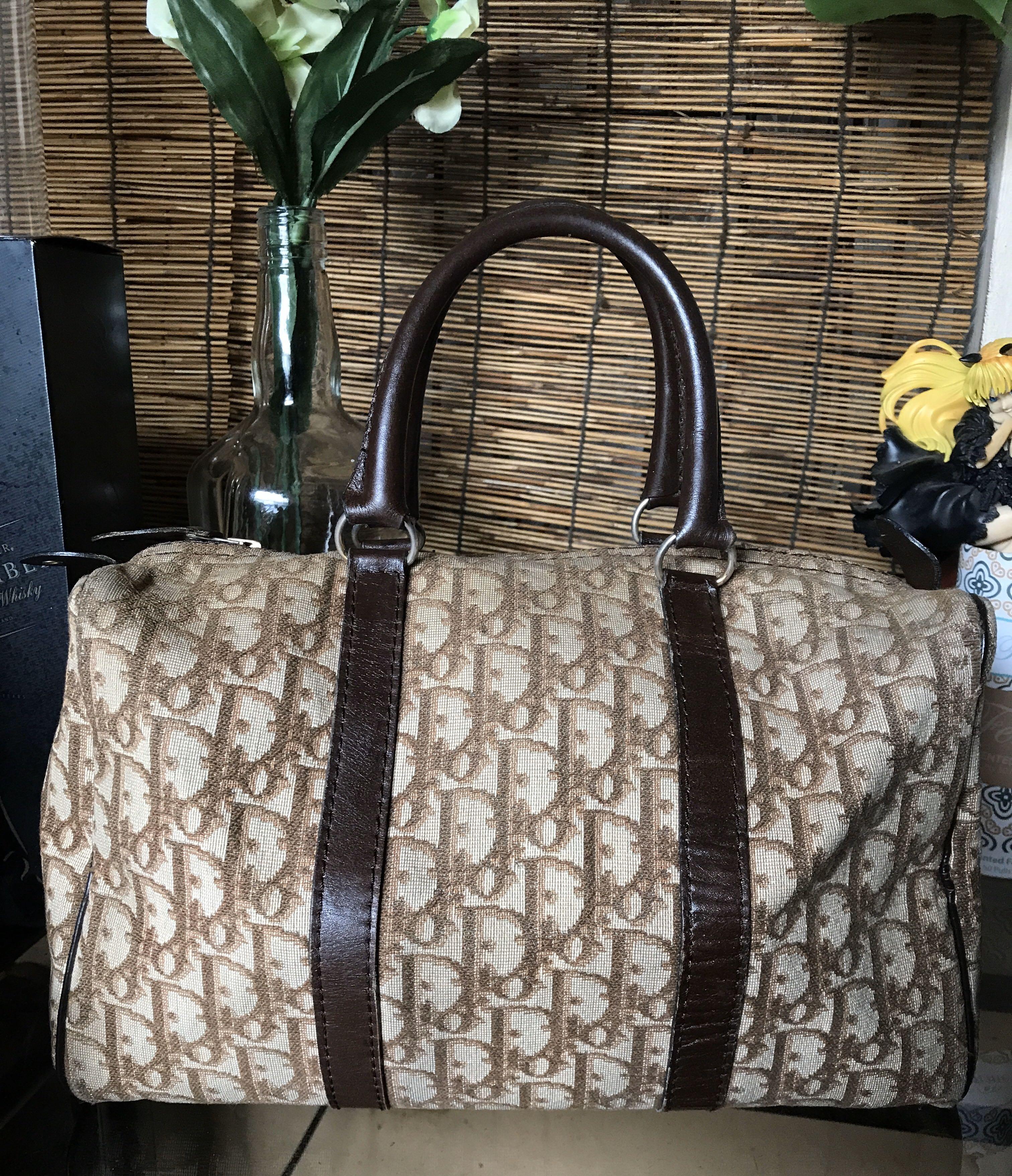 Dior Boston (Category: Luxury Bags & Wallets) located in Quezon City. Submitted by whatsinmyclosett (Listing ID 1012127342, Image 1). Description: CHRISTIAN DIOR DIOR BOSTON VINTAGE BAG 80’s this is an authentic Christian jDior Camel brown Trotter Boston bag in excellent Vintage condition. This gorgeous bag is made of Brown Monogram Canvas and leather trim. Stand out from the crowd with this designer bag! ☑️💯ORIGINAL ☑️Made in France ☑️Vintage B