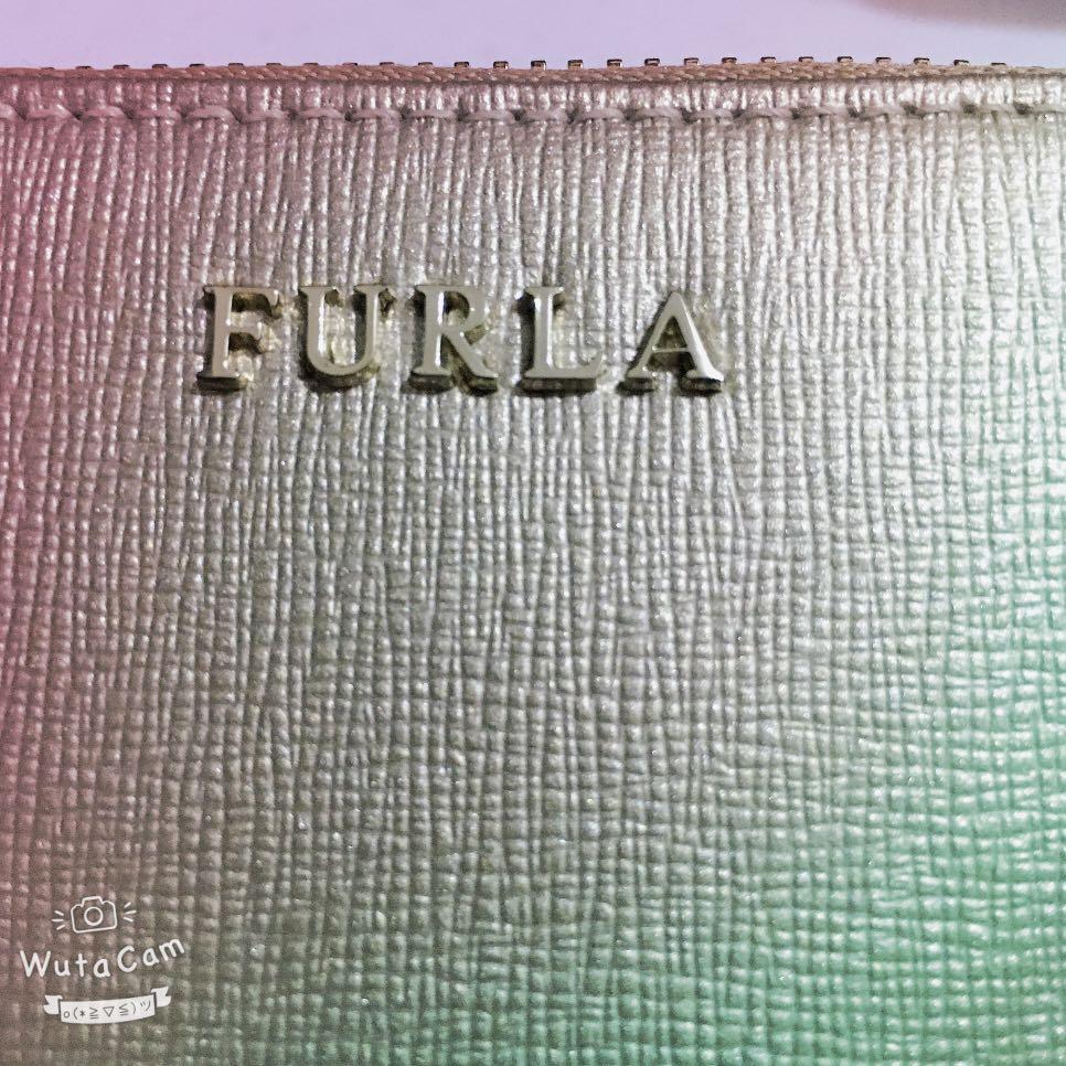 Very Fresh Furla Wallet (Category: Wallets & Card holders) located in Quezon City. Submitted by anna4u (Listing ID 1012094300, Image 2). Description: zip wallet. Original bought in japan. Gold color no box wallet only.