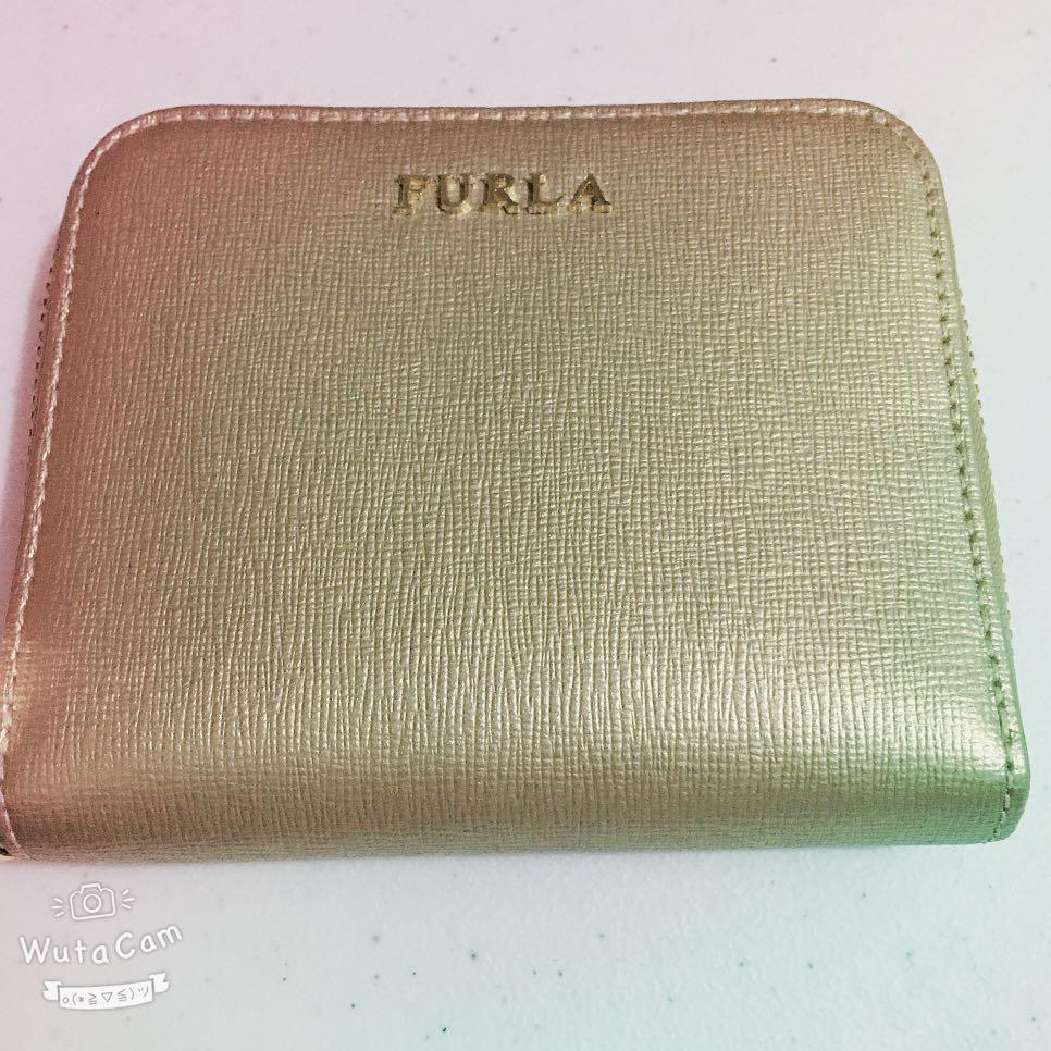 Very Fresh Furla Wallet (Category: Wallets & Card holders) located in Quezon City. Submitted by anna4u (Listing ID 1012094300, Image 1). Description: zip wallet. Original bought in japan. Gold color no box wallet only.