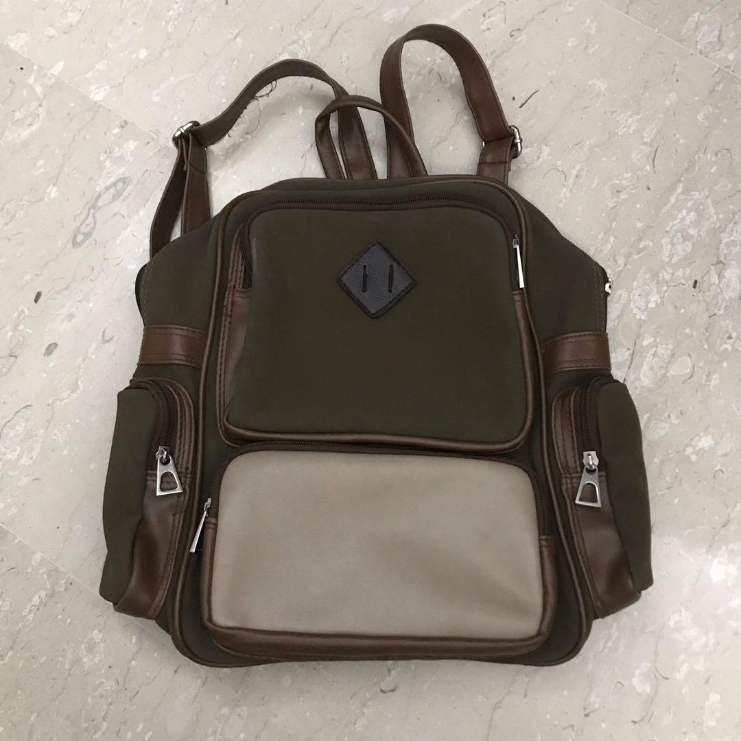 Brown Backpack (Category: Backpacks) located in Singapore. Submitted by flyingpigss (Listing ID 1012420732, Image 1). Description: Very cute piece🌷 Condition 8/10✨ Strings on the straps cane off but can be cut away🌿.