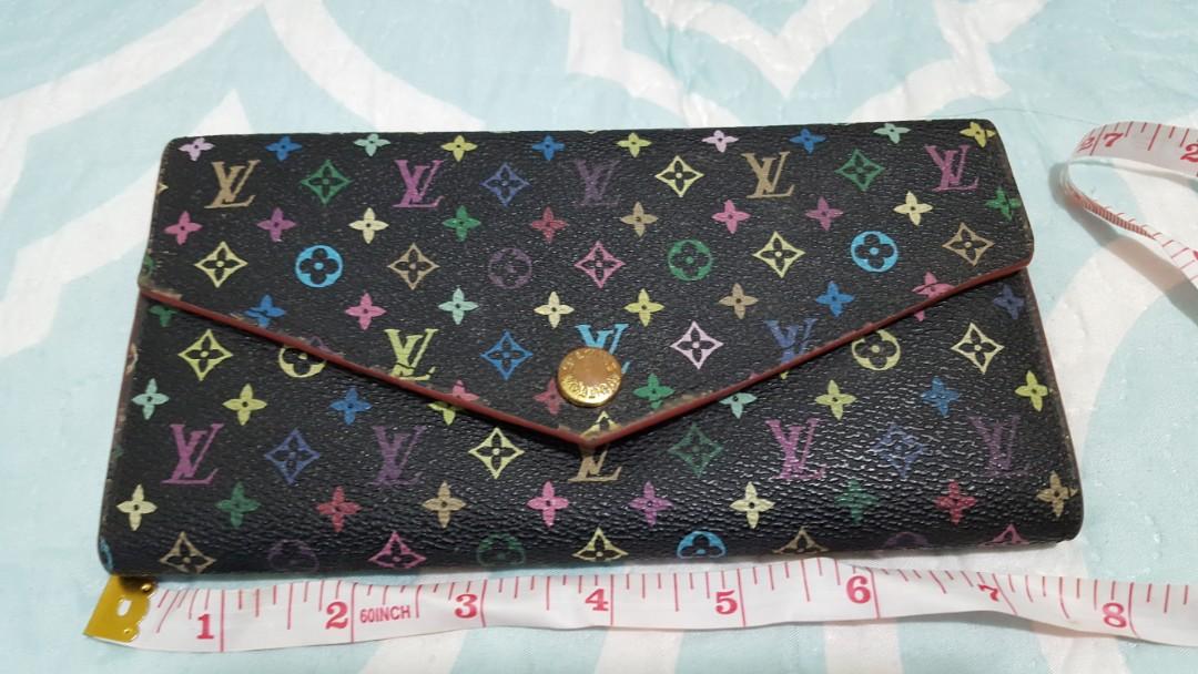 LV multicolored long wallet (Category: Luxury Bags & Wallets) located in Baguio. Submitted by lotus_blossom (Listing ID 1012206634, Image 1). Description: LV multicolored logo wallet NO CODE Not guaranteed see posted flaws Exclusive JRS Shipping.