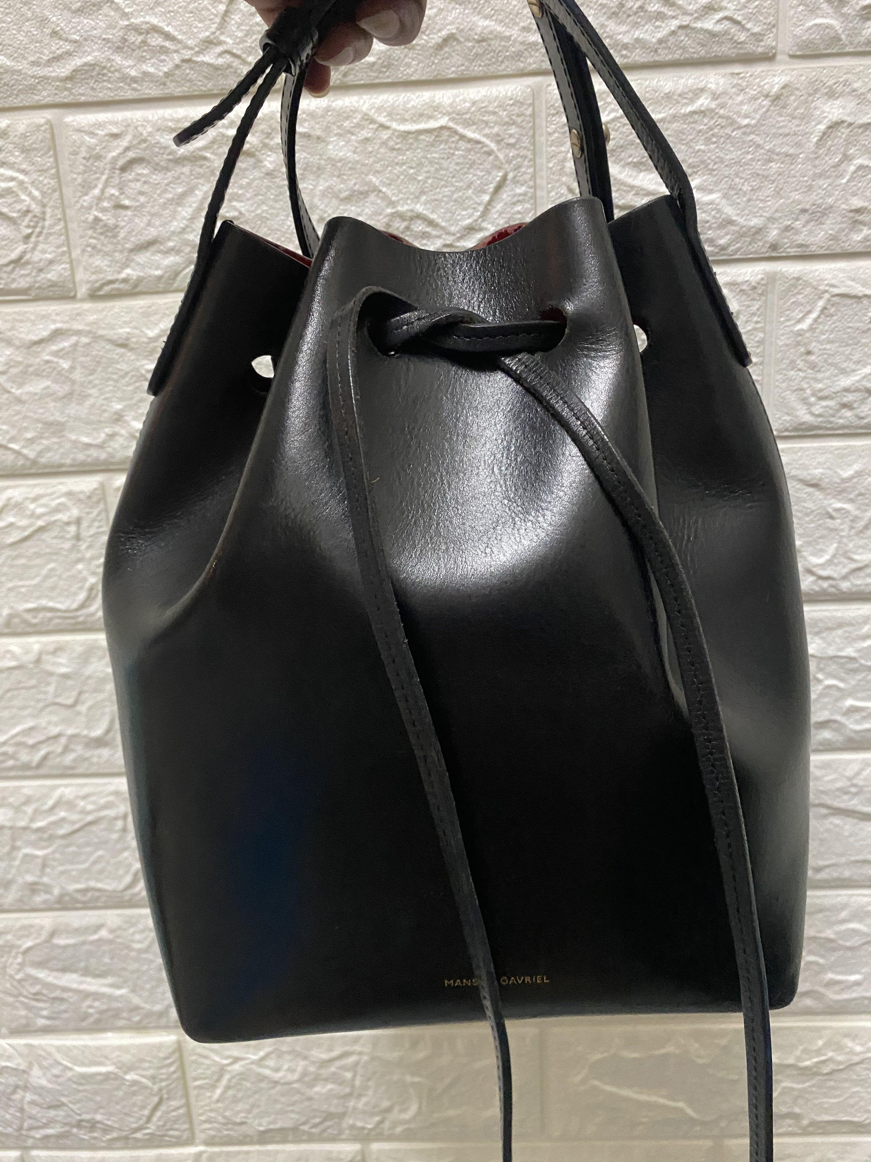 Mansur Gavriel Mini Bucket Bag (Category: Luxury Bags & Wallets) located in Muntinlupa City. Submitted by bduchess (Listing ID 1012356664, Image 2). Description: Disposal sale! 10k nalang po. Complete with dustbag and care cards. Authentic Mansur Gavriel. Yug scratches normal signs of usage kasi yung leather nya po. Nagpepeel yung red, I emailed MG regarding that they want me to send the bag sa US para ayusin pero since hassle hinayaan ko nalang.